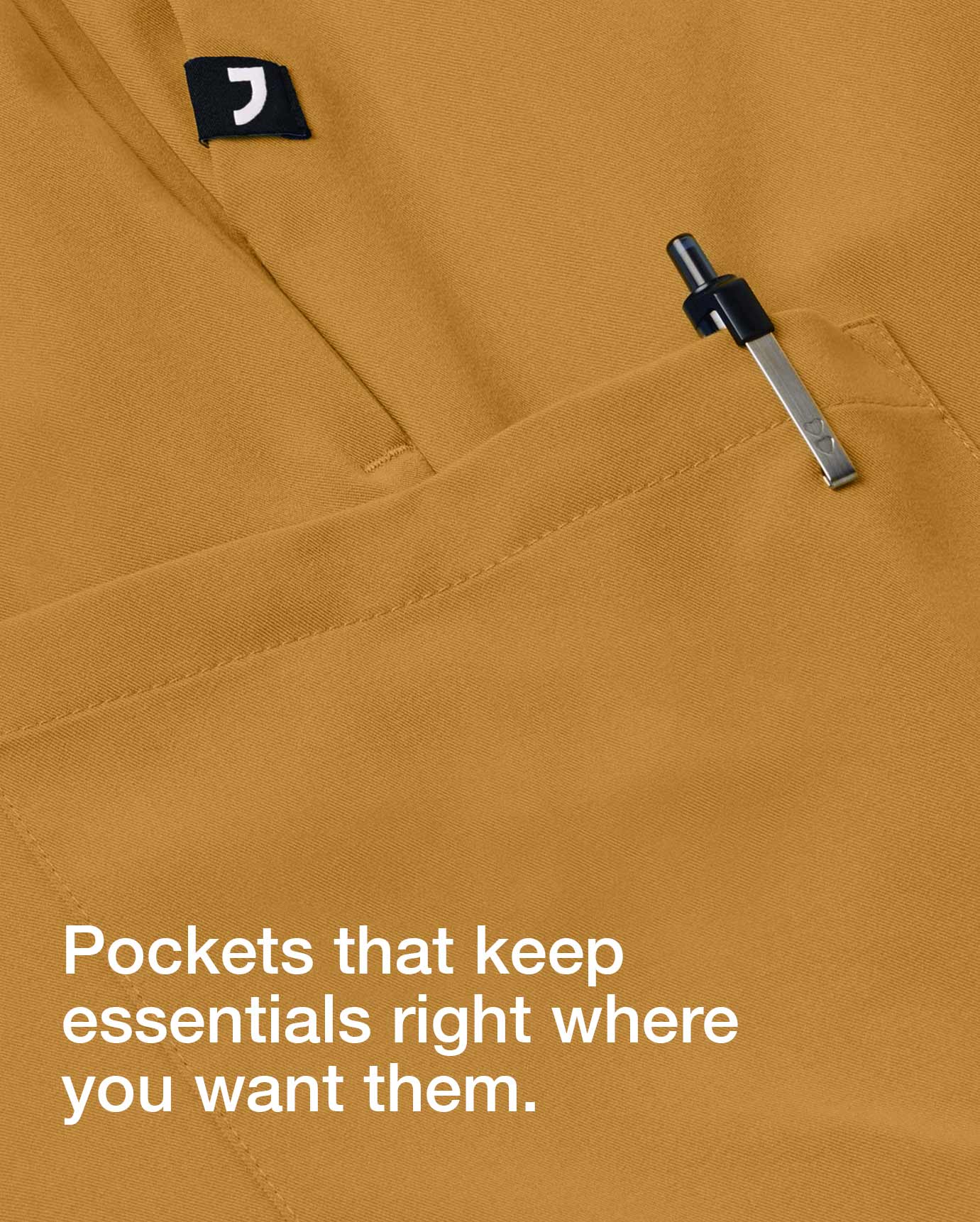 Closeup image of Cider colored scrub fabric. Image has text, "Pockets that keep essentials right where you want them.".
