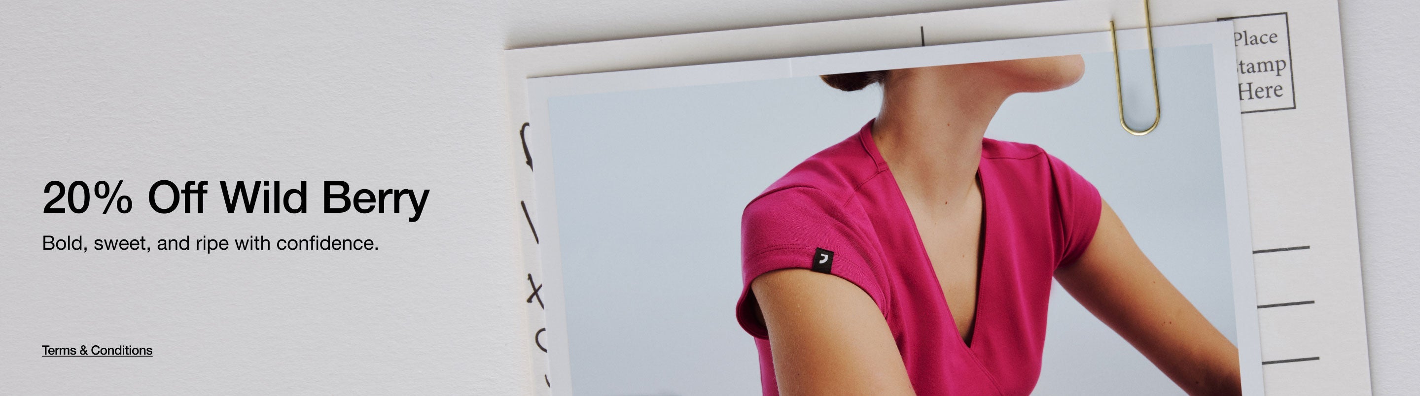 Image of woman wearing a Wild Berry colored scrub top. Image has text, "20% Off Wild Berry. Bold, sweet, and ripe with confidence. Click to see Terms and Conditions."