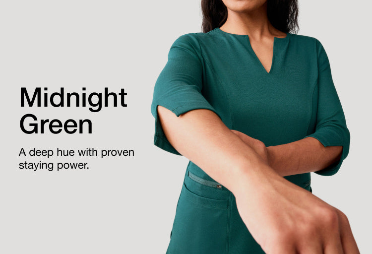 Image of woman wearing Midnight Green scrubs, image has text, "Midnight Green: A deep hue with proven staying power."