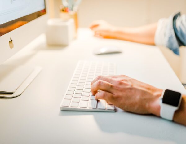 A person sitting in front of a computer.
