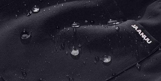 Closeup image of fabric with PFC-Free water repellent. Water droplets are repelled from the fabric.