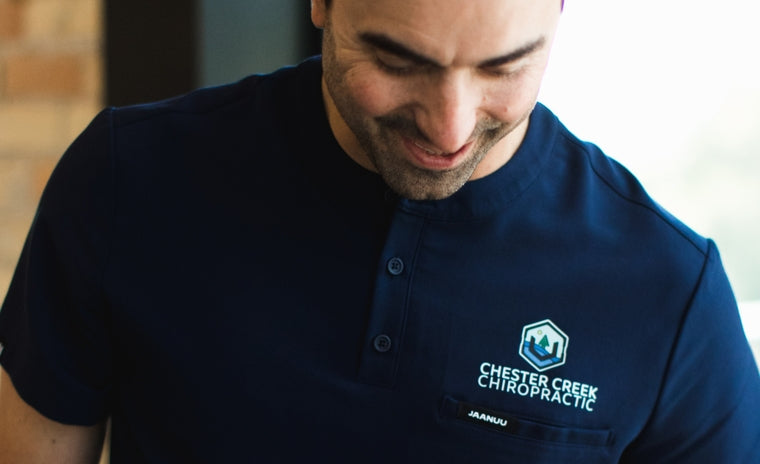 Image of healthcare professional wearing scrubs with decoration.