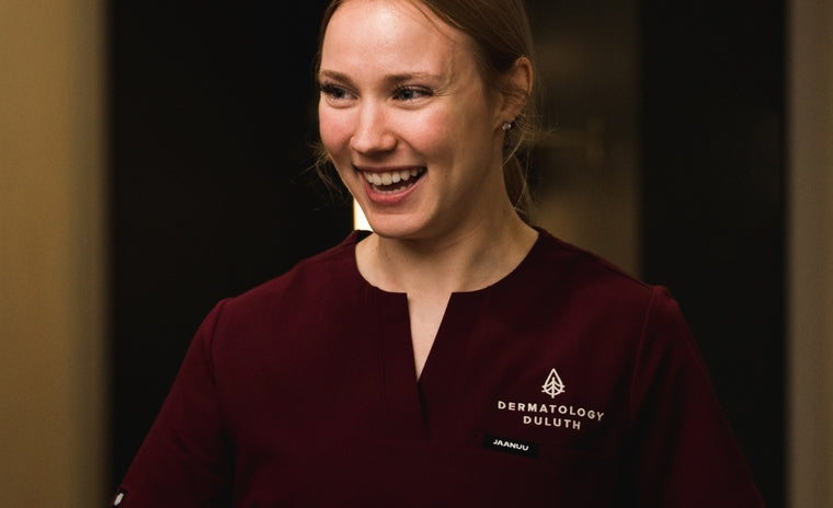 Image of healthcare professional wearing scrubs with decoration.