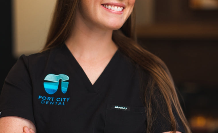 Image of healthcare professional wearing scrubs with decoration.