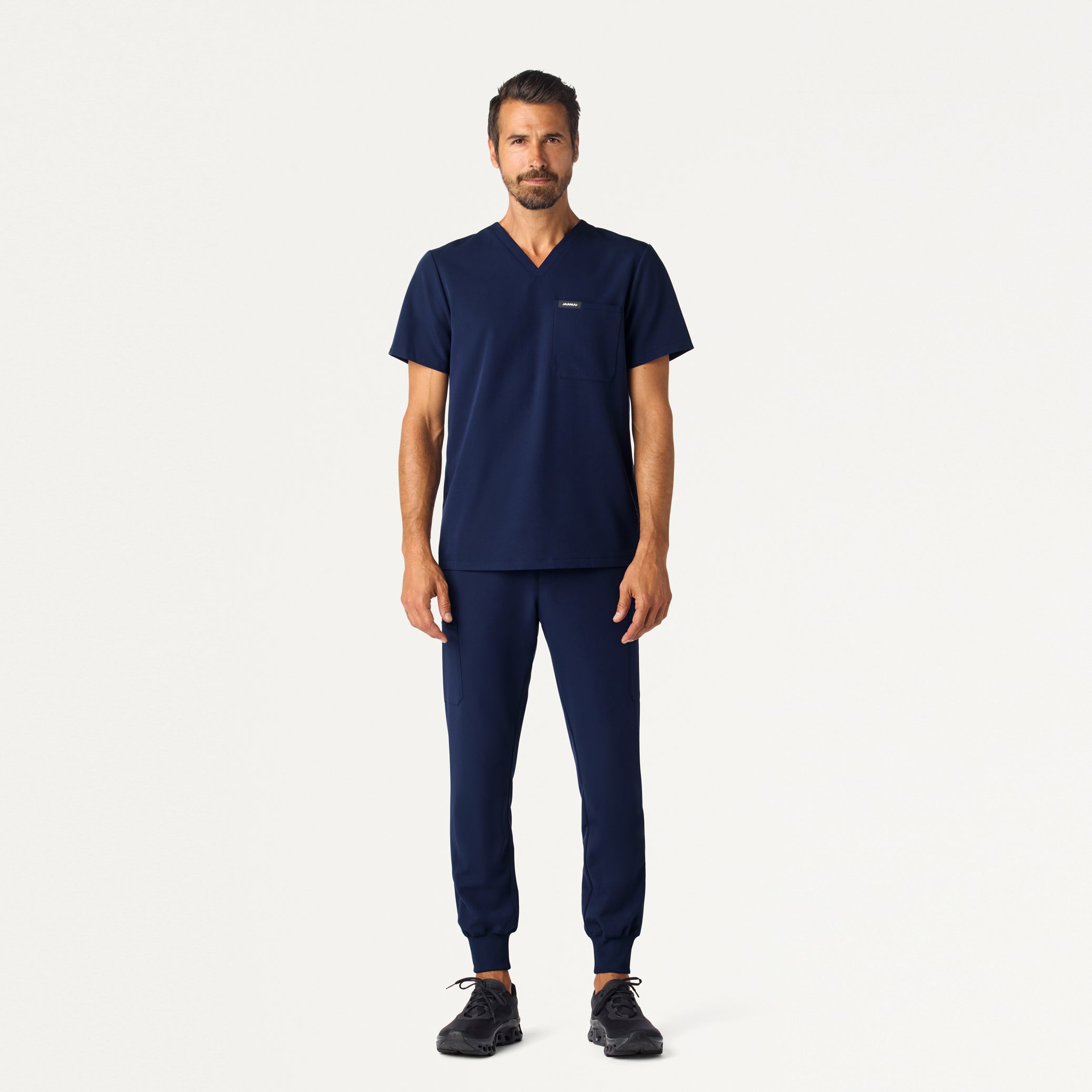 Man wearing Midnight Navy scrub set.