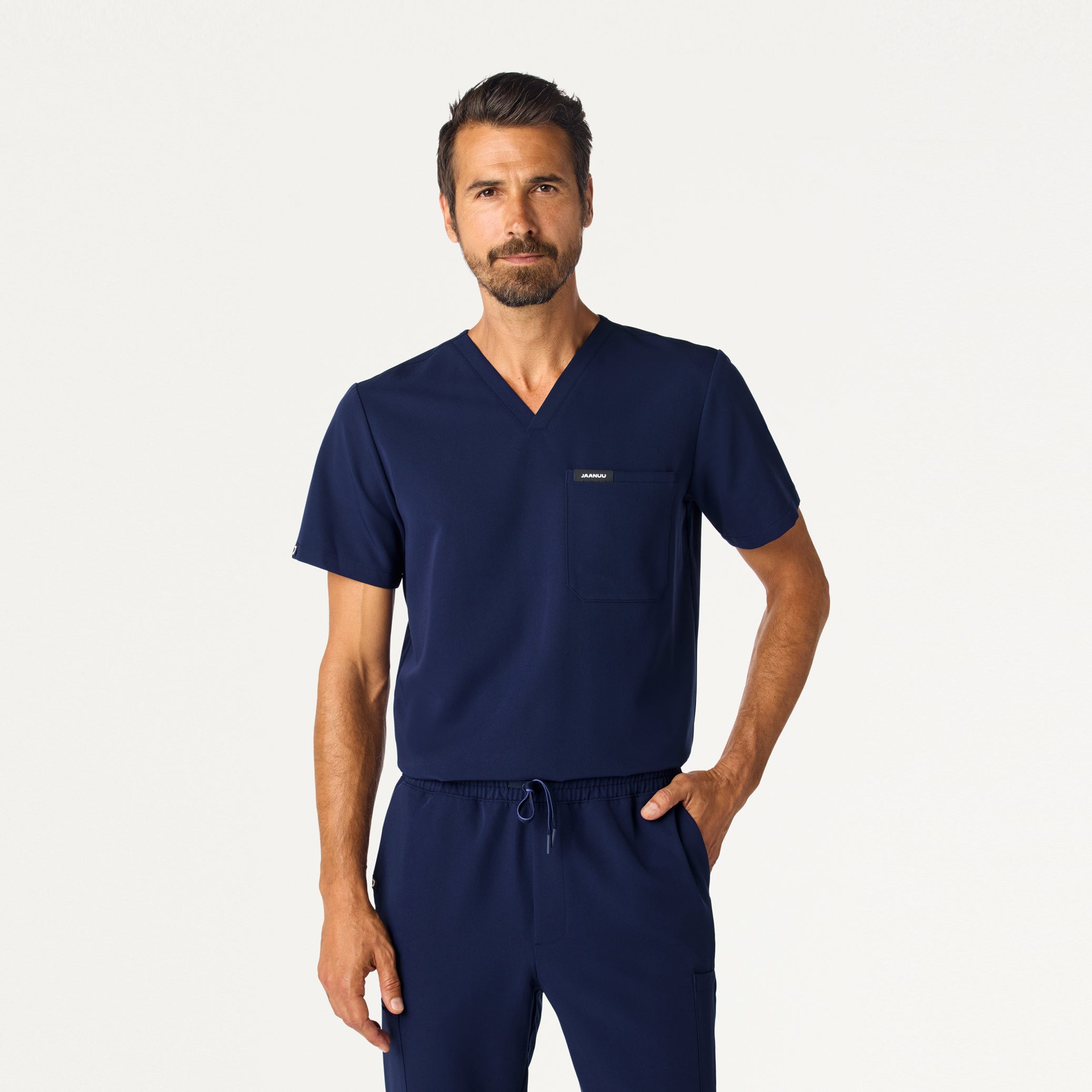 Man wearing Midnight Navy scrub top.