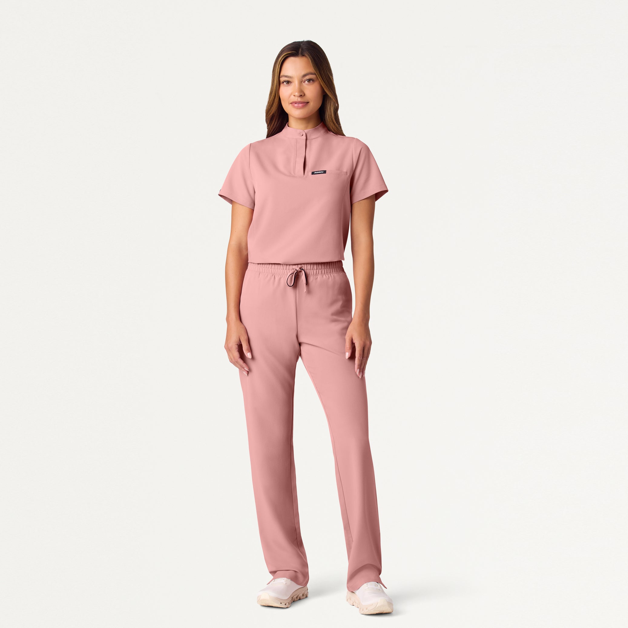 Woman wearing Mauve scrub set